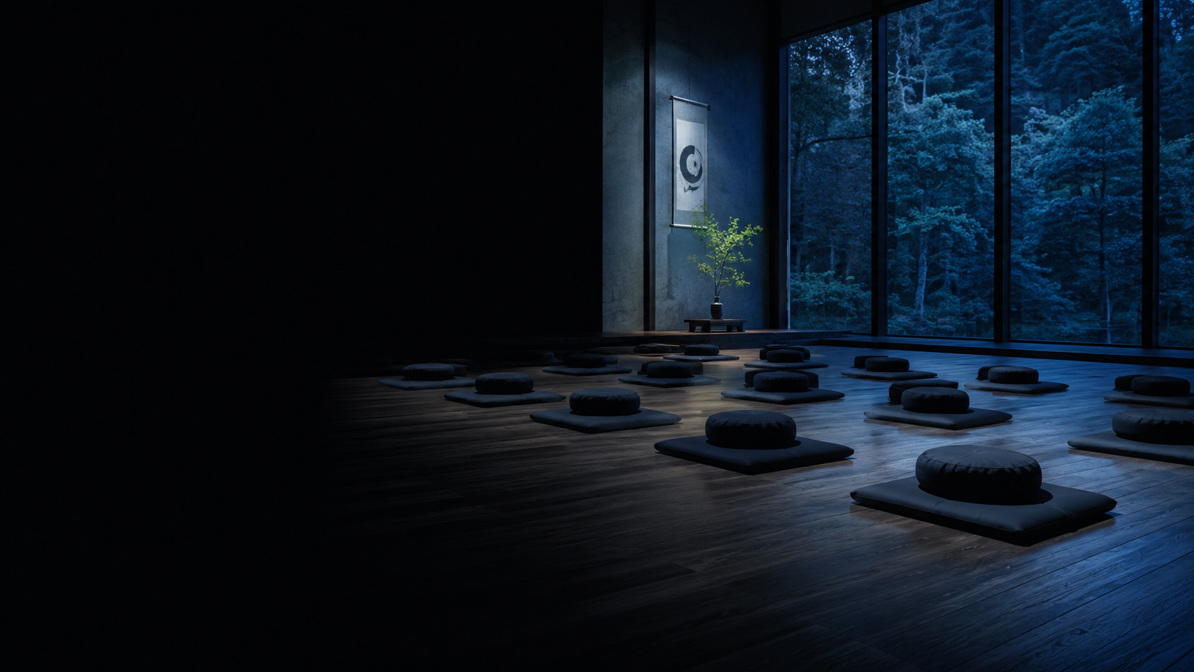 Sala de meditación vacía con cojines alineados en penumbra a la hora azul, sin nadie a la vista
